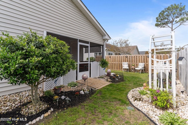 view of yard featuring a sunroom