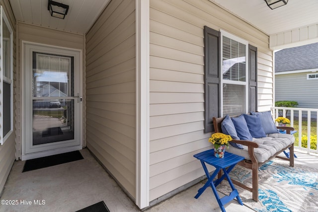 view of exterior entry featuring a porch