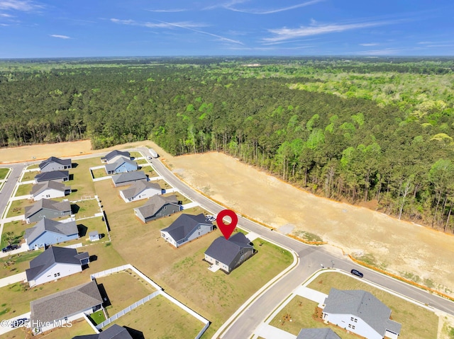 645 Ashvale Ln SE, Bolivia, NC 28422 - birds eye view of property featuring a wooded view and a residential view