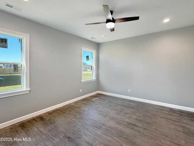 GEORGETOWN Spinnaker Dr, Elizabeth City, NC 27909 - empty room featuring baseboards, dark wood-style floors, and visible vents