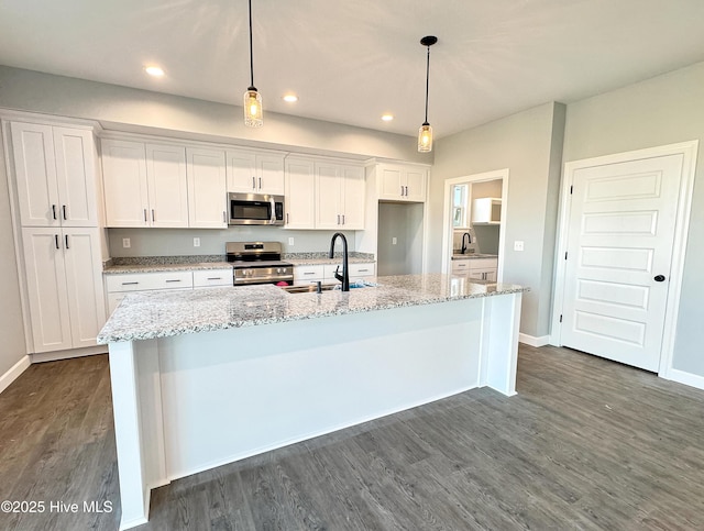 GEORGETOWN Spinnaker Dr, Elizabeth City, NC 27909 - kitchen with white cabinets, dark wood-style floors, a sink, and appliances with stainless steel finishes