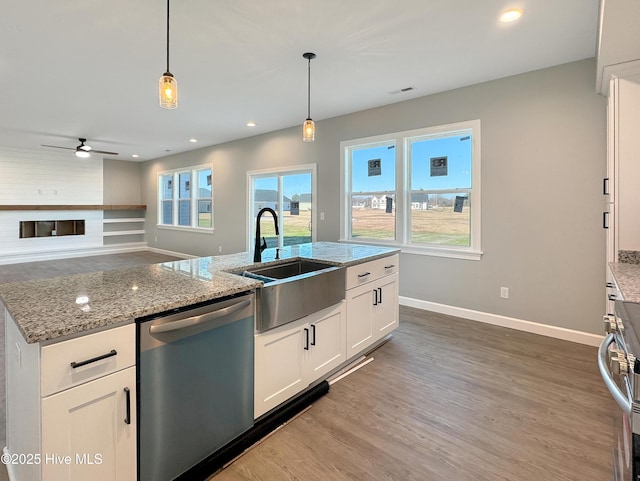 GEORGETOWN Spinnaker Dr, Elizabeth City, NC 27909 - kitchen with hanging light fixtures, white cabinets, a sink, wood finished floors, and stainless steel dishwasher