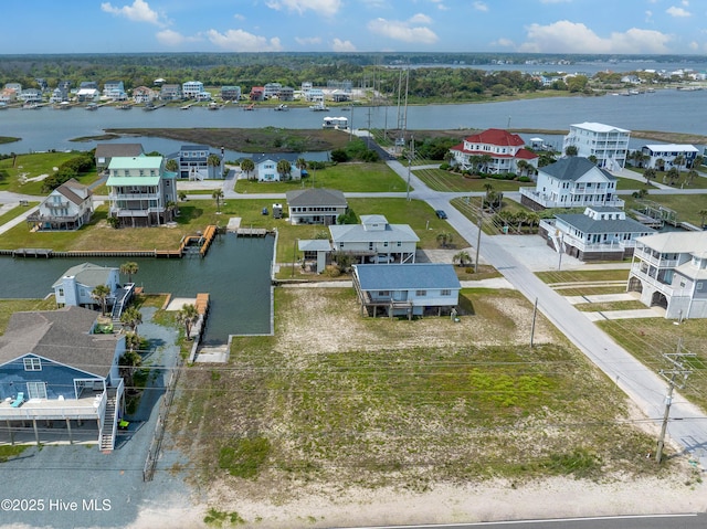 bird's eye view featuring a residential view and a water view