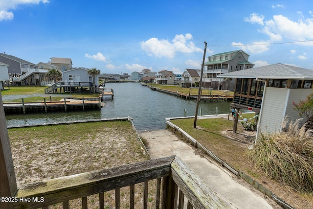 dock area featuring a residential view and a water view