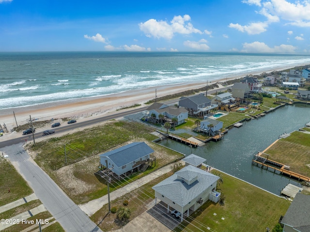 bird's eye view featuring a view of the beach and a water view