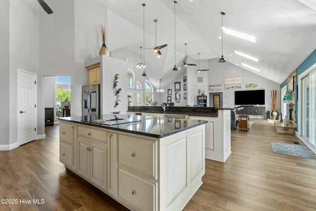 111 Waterway Ct, Aydlett, NC 27916 - kitchen featuring a kitchen island, high vaulted ceiling, electric stovetop, stainless steel fridge with ice dispenser, and a ceiling fan