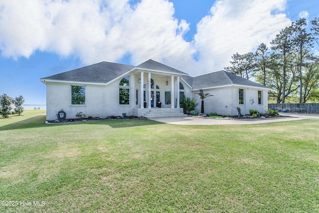111 Waterway Ct, Aydlett, NC 27916 - view of front facade featuring roof with shingles, fence, and a front yard