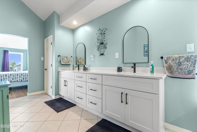 111 Waterway Ct, Aydlett, NC 27916 - full bathroom featuring double vanity, a sink, tile patterned flooring, and vaulted ceiling