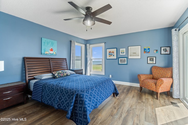 111 Waterway Ct, Aydlett, NC 27916 - bedroom with ceiling fan, baseboards, visible vents, and wood finished floors