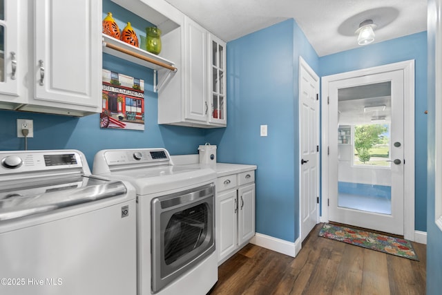 111 Waterway Ct, Aydlett, NC 27916 - washroom with baseboards, cabinet space, washing machine and dryer, and dark wood finished floors