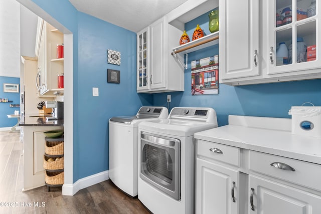 111 Waterway Ct, Aydlett, NC 27916 - laundry area featuring cabinet space, baseboards, dark wood finished floors, and washing machine and dryer