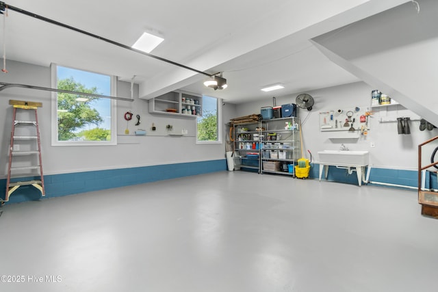 111 Waterway Ct, Aydlett, NC 27916 - garage featuring a workshop area, a sink, and a garage door opener