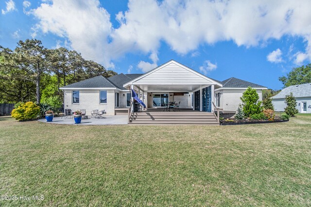 111 Waterway Ct, Aydlett, NC 27916 - back of property featuring a yard and a patio area