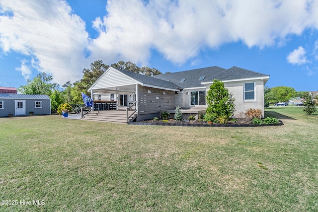 111 Waterway Ct, Aydlett, NC 27916 - rear view of property featuring brick siding, a shingled roof, and a yard