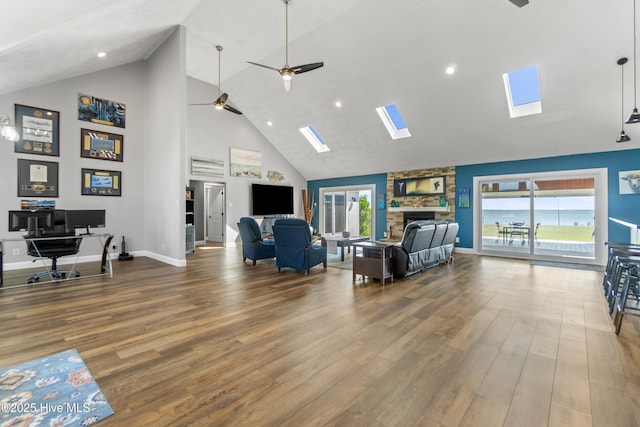 111 Waterway Ct, Aydlett, NC 27916 - living area featuring a skylight, high vaulted ceiling, and wood finished floors