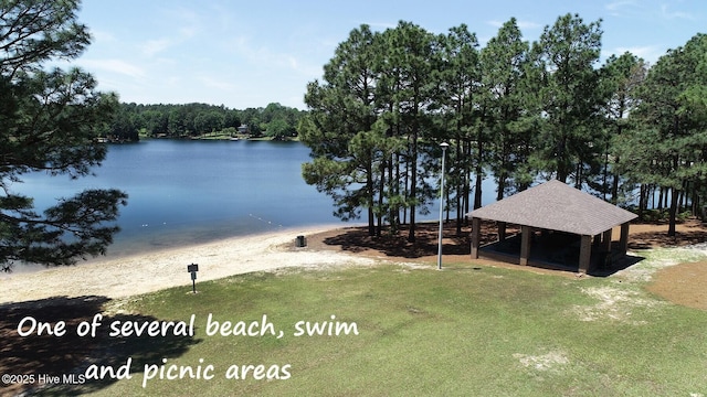 drone / aerial view featuring a wooded view
