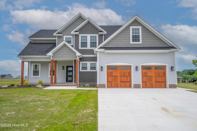craftsman house featuring concrete driveway, a front lawn, a porch, a garage, and roof with shingles