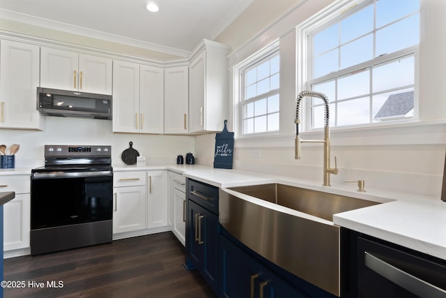 kitchen with stainless steel electric range, dishwasher, light countertops, white cabinets, and dark wood-style flooring