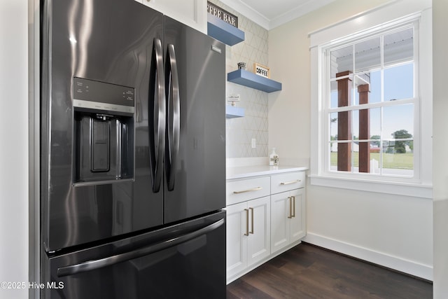 kitchen featuring baseboards, white cabinetry, crown molding, stainless steel fridge with ice dispenser, and dark wood-type flooring