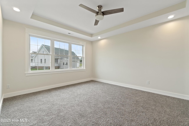 empty room featuring recessed lighting, carpet, baseboards, and ceiling fan