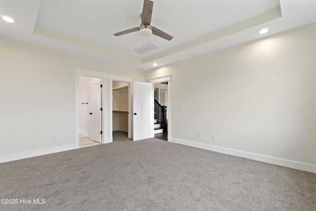 unfurnished bedroom with baseboards, carpet floors, visible vents, and recessed lighting
