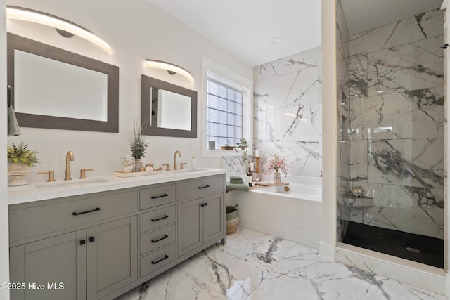 bathroom featuring double vanity, marble finish floor, a marble finish shower, and a sink