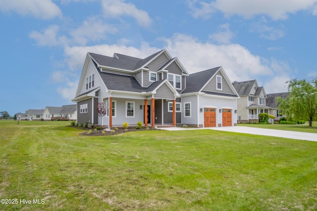 craftsman inspired home featuring concrete driveway, a front lawn, and a porch