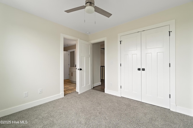 unfurnished bedroom featuring carpet floors, a closet, baseboards, and ceiling fan