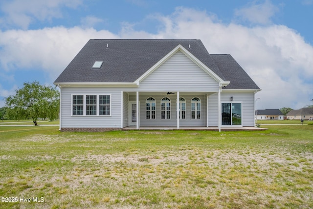 rear view of house with a lawn