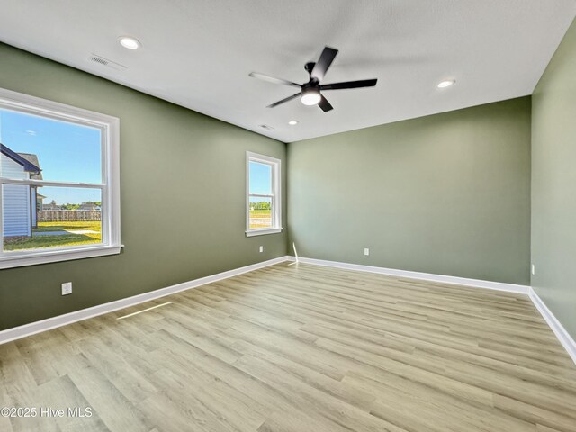unfurnished room featuring light wood-type flooring, visible vents, baseboards, recessed lighting, and a ceiling fan