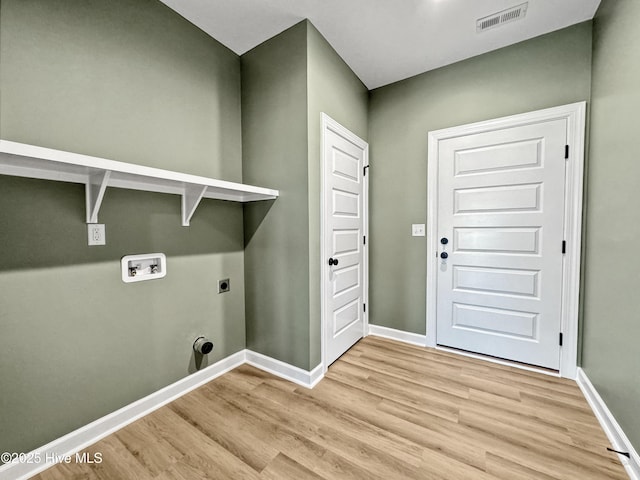 laundry room featuring electric dryer hookup, light wood finished floors, visible vents, laundry area, and washer hookup