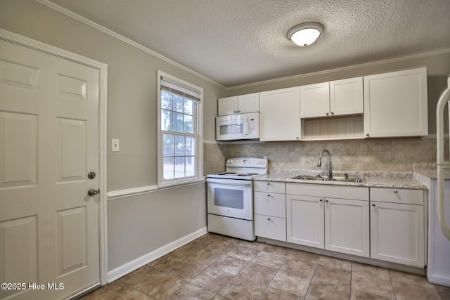 kitchen with white cabinets, ornamental molding, a sink, white appliances, and baseboards