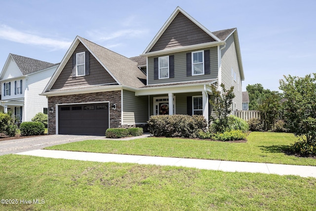 6509 Fawn Settle Dr, Wilmington, NC 28409 - view of front of property with concrete driveway, stone siding, a front lawn, and a garage