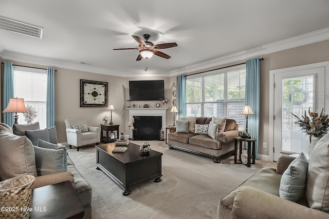 6509 Fawn Settle Dr, Wilmington, NC 28409 - living area featuring ornamental molding, ceiling fan, light colored carpet, and a fireplace