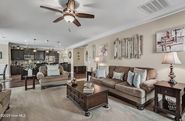 6509 Fawn Settle Dr, Wilmington, NC 28409 - living area with a ceiling fan, crown molding, recessed lighting, and light wood-style floors