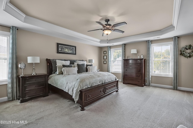6509 Fawn Settle Dr, Wilmington, NC 28409 - bedroom featuring a tray ceiling, light colored carpet, crown molding, and a ceiling fan