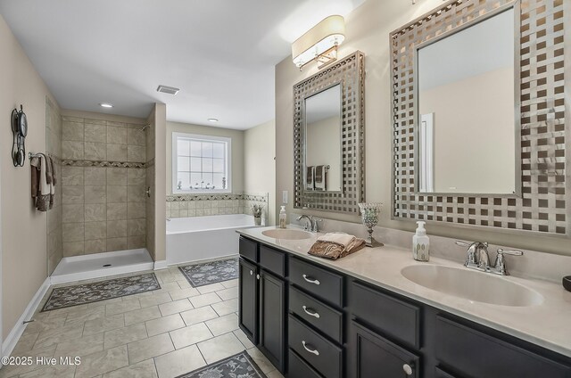 6509 Fawn Settle Dr, Wilmington, NC 28409 - full bathroom featuring double vanity, a garden tub, a tile shower, and tile patterned floors