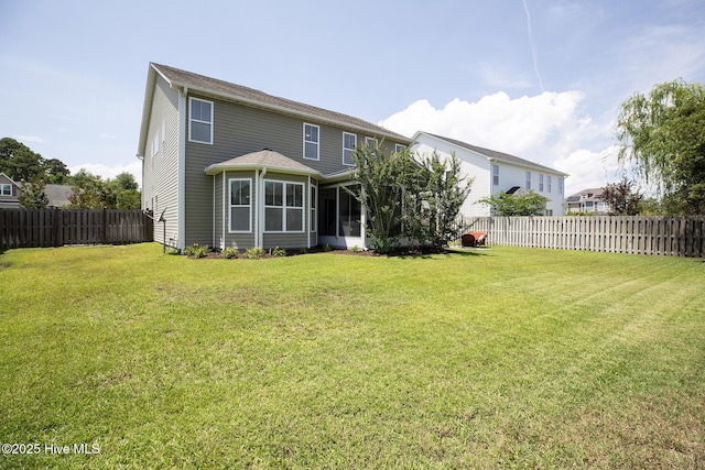 6509 Fawn Settle Dr, Wilmington, NC 28409 - rear view of property featuring a fenced backyard and a sunroom