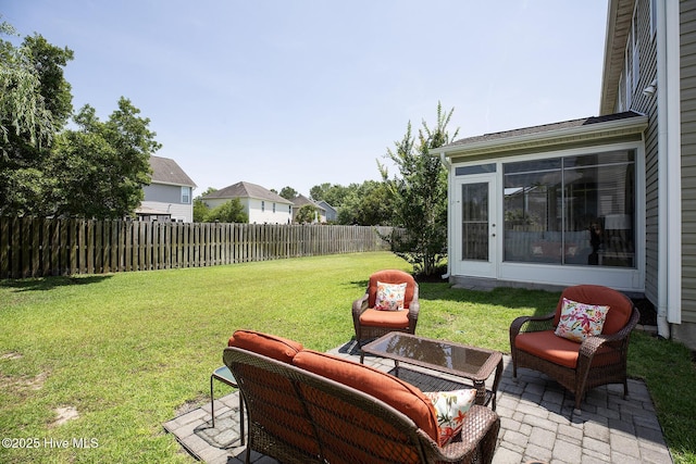 6509 Fawn Settle Dr, Wilmington, NC 28409 - fenced backyard featuring a patio and an outdoor living space
