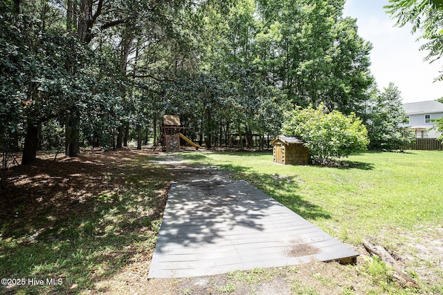 6509 Fawn Settle Dr, Wilmington, NC 28409 - view of yard featuring a playground and a storage unit