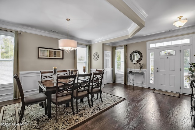 6509 Fawn Settle Dr, Wilmington, NC 28409 - dining space featuring crown molding, wainscoting, and dark wood-style flooring