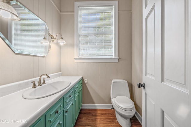 1401 W Queen St, Edenton, NC 27932 - half bath with wood finished floors, vanity, toilet, and baseboards