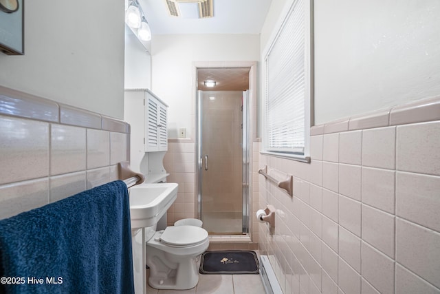 1401 W Queen St, Edenton, NC 27932 - full bath with a stall shower, tile walls, toilet, tile patterned flooring, and visible vents