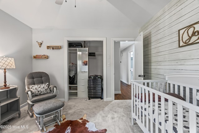 1401 W Queen St, Edenton, NC 27932 - bedroom featuring baseboards, carpet, lofted ceiling, a closet, and wooden walls