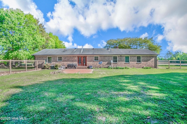 1401 W Queen St, Edenton, NC 27932 - rear view of property featuring a lawn, french doors, a fenced backyard, a patio, and brick siding