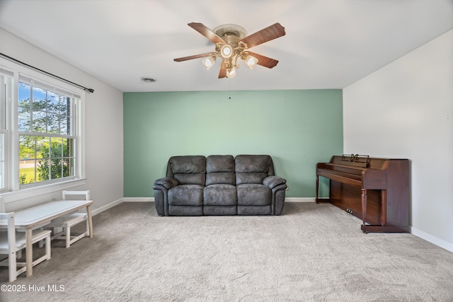 1401 W Queen St, Edenton, NC 27932 - living area with baseboards, a ceiling fan, and carpet flooring