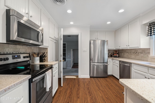 1401 W Queen St, Edenton, NC 27932 - kitchen featuring white cabinetry, appliances with stainless steel finishes, dark wood-type flooring, and visible vents