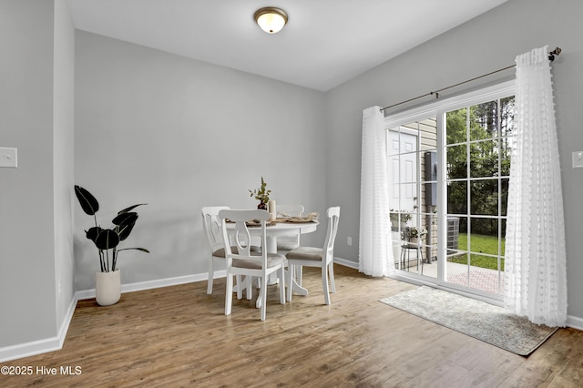 141 Beacon Woods Dr, Holly Ridge, NC 28445 - dining space with wood finished floors and baseboards