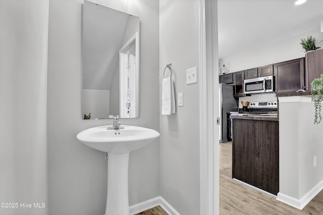 141 Beacon Woods Dr, Holly Ridge, NC 28445 - bathroom with wood finished floors and baseboards