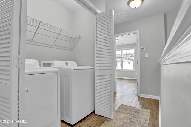 141 Beacon Woods Dr, Holly Ridge, NC 28445 - washroom featuring washer and clothes dryer, wood finished floors, and baseboards